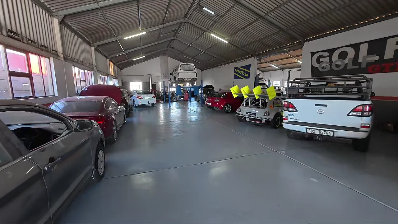 The scale of R-Tech’s workshop, with service lifts and vehicles inside